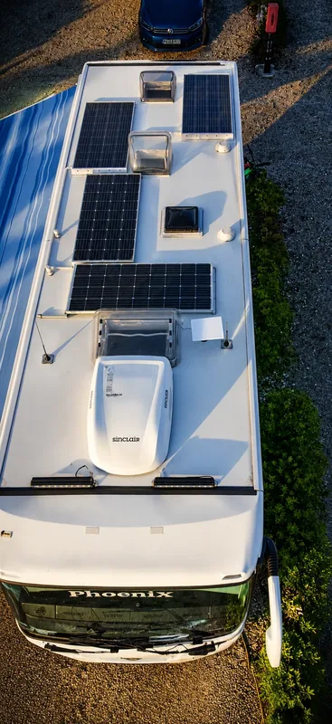Vehicle roof with solar panels and air-conditioning